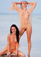 Olga K and Vera E love swimming in the sea and playing with each other at once.