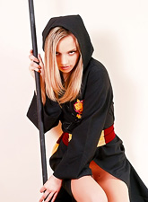 Attractive teen bunny Kristina Fey takes off her kimono and poses like a wizard.